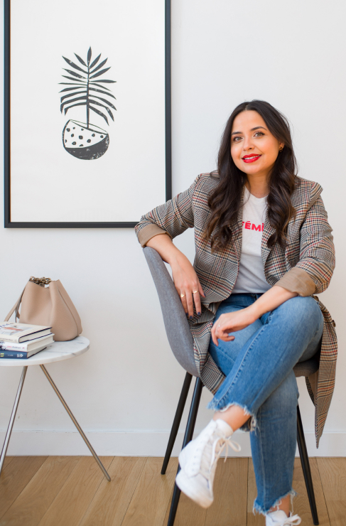 Lisa Rosado, founder of We Are Women Owned, sitting in a chair